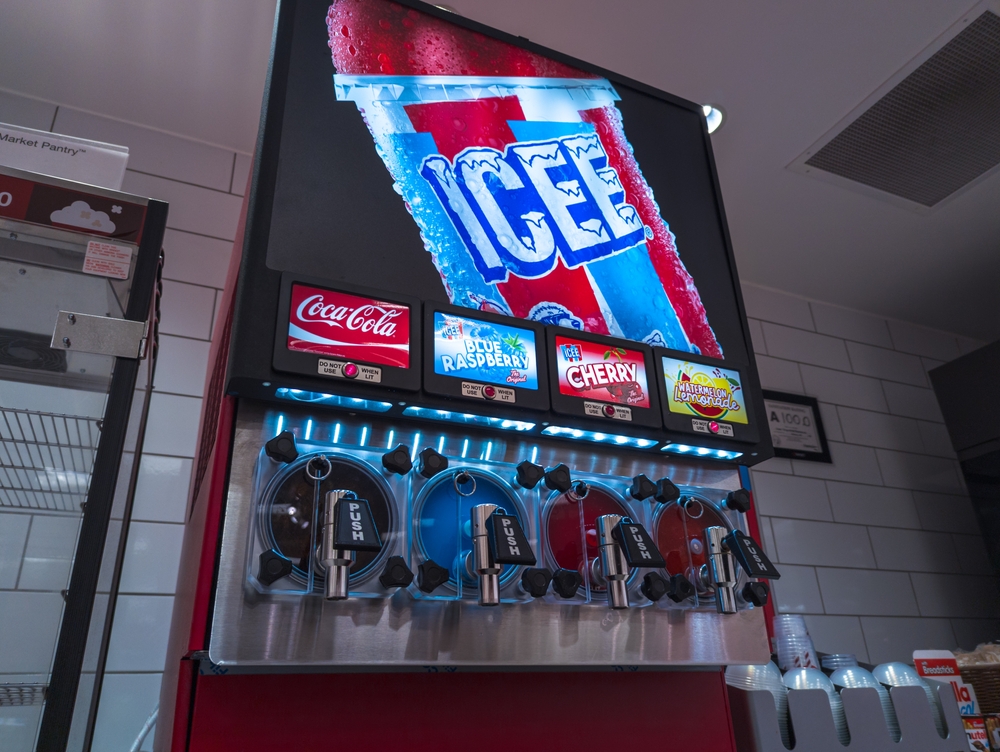 Apex, North Carolina - August 20 2025: A Brightly Lit Icee Coca Cola And Blue Raspberry Slushie Machine At Target