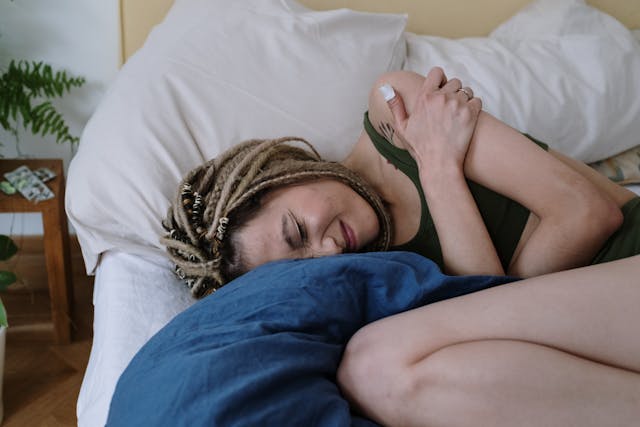 Woman in pain on couch