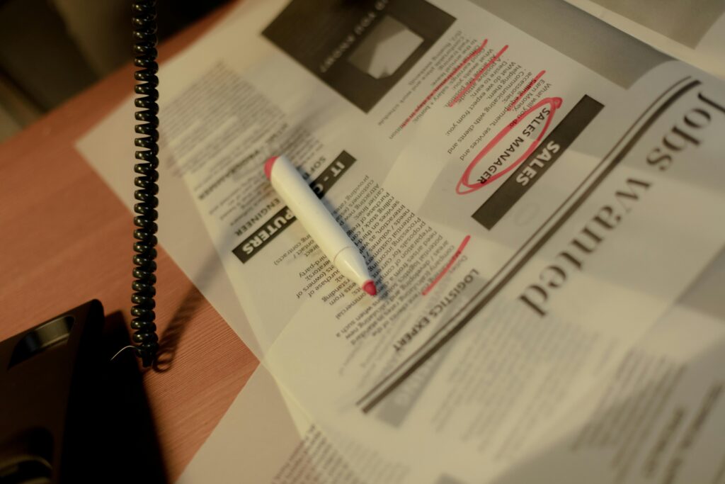 Person making call while searching for job
