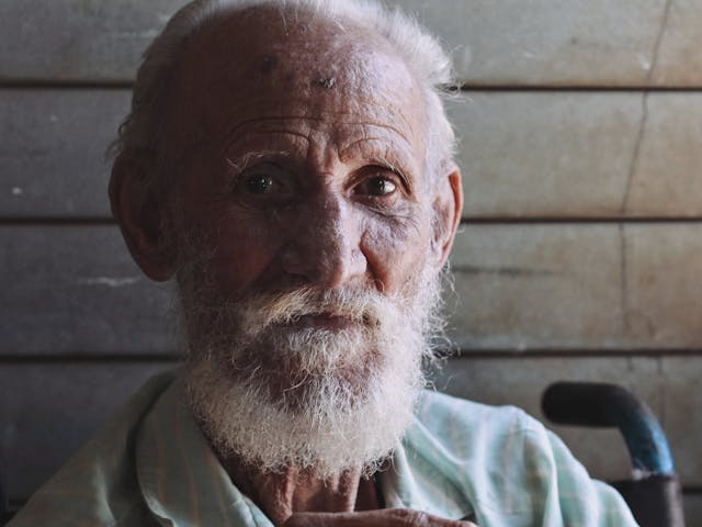 Elderly man seated