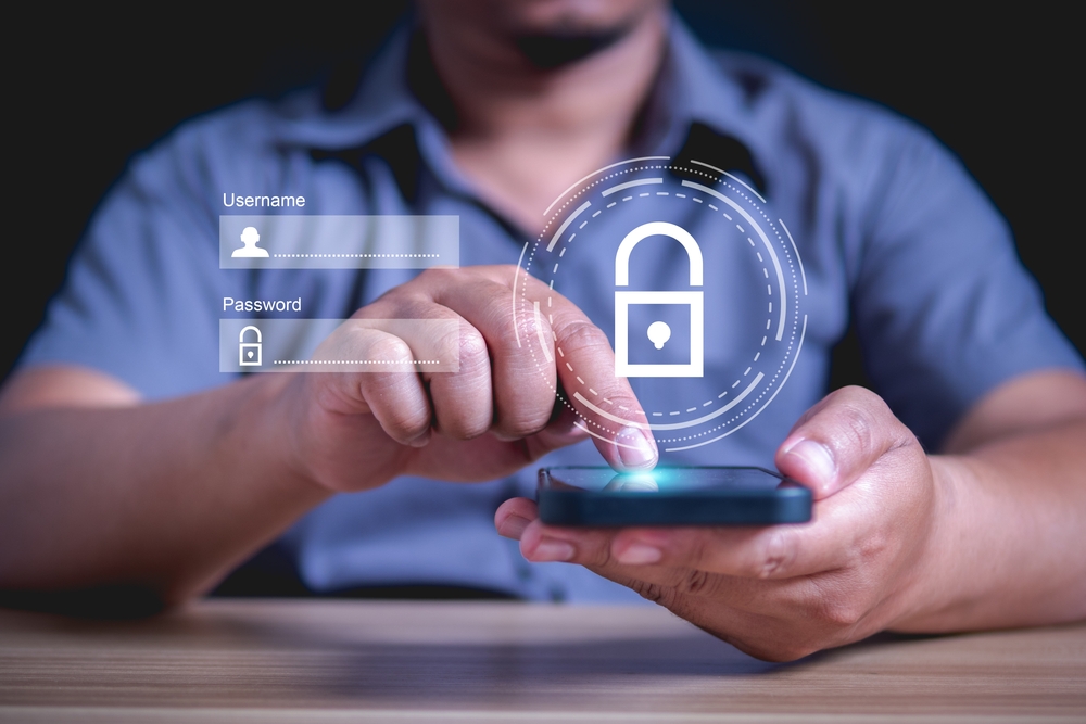 Man using a smartphone with a login interface and padlock icon. Cybersecurity and Data Protection Concept.
