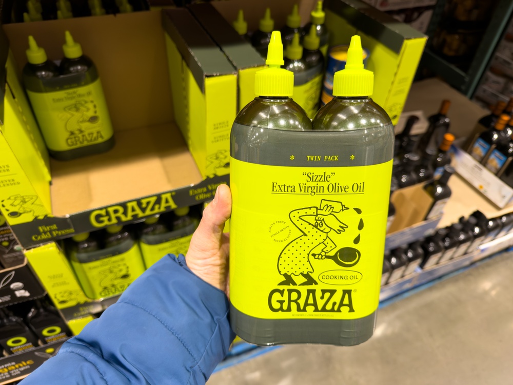Los Angeles, CA - December 12, 2025: Graza Sizzle Extra Virgin Olive Oil Bottle Display.