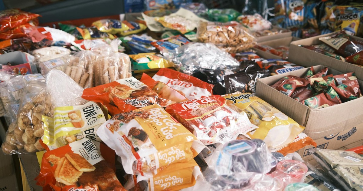 Vibrant array of assorted packaged snacks and candies displayed indoors, perfect for a snack shop or market.