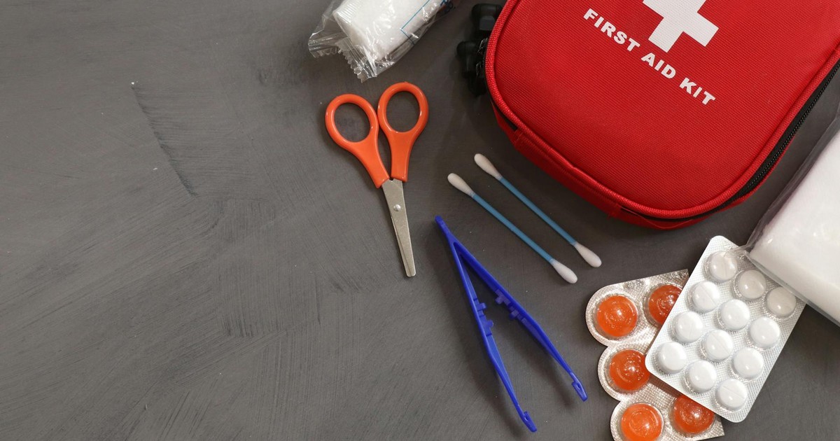A comprehensive first aid kit with essential medical tools and supplies for emergencies.