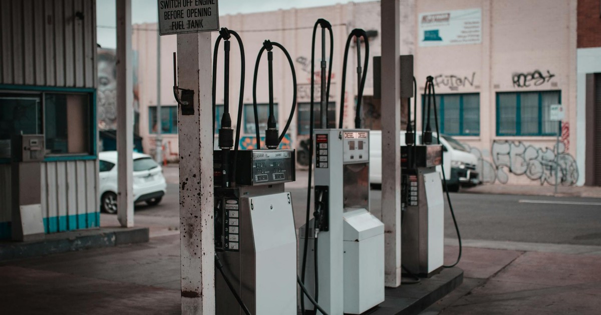 Empty gas station with visible graffiti in Collingwood, Australia.