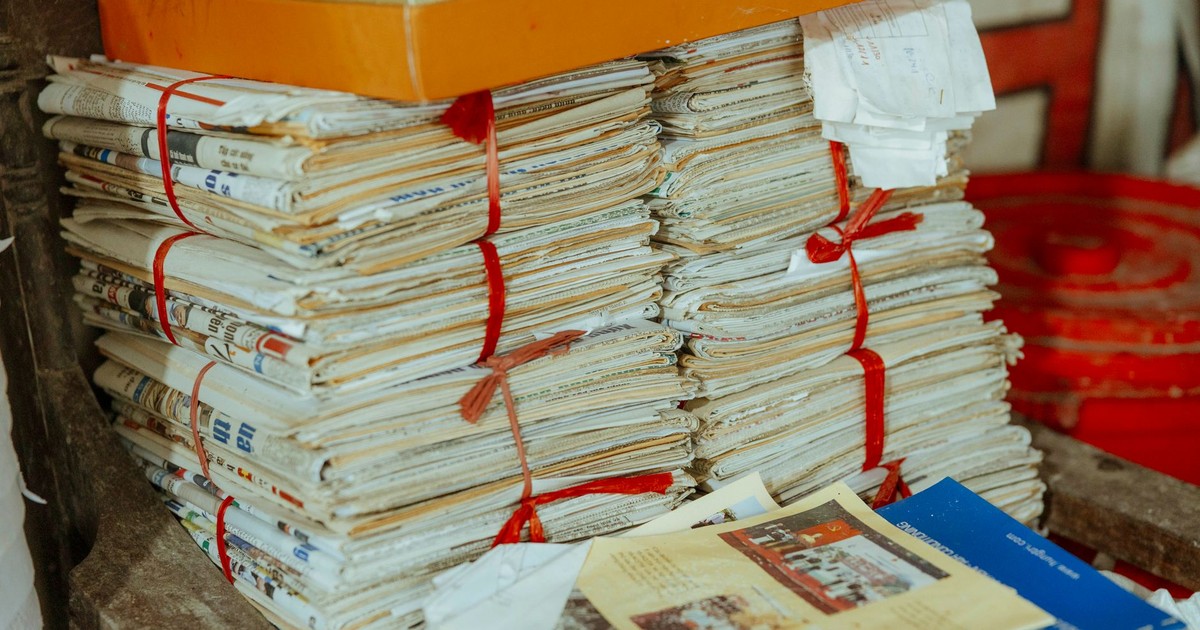 Bundles of newspapers bound together, showcasing vintage reading material.