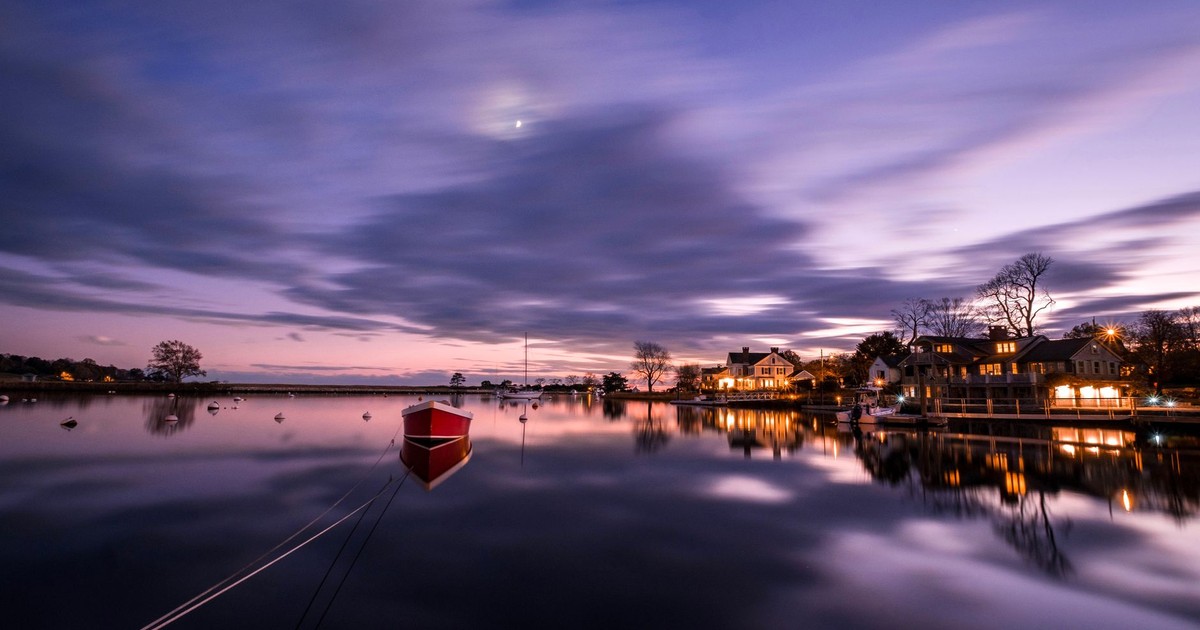 Calm evening scene with reflections on the water in Fairfield, Connecticut.