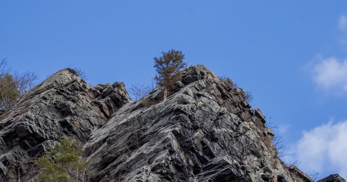 A striking view of rocky cliffs against a clear blue sky in Harpers Ferry, WV.