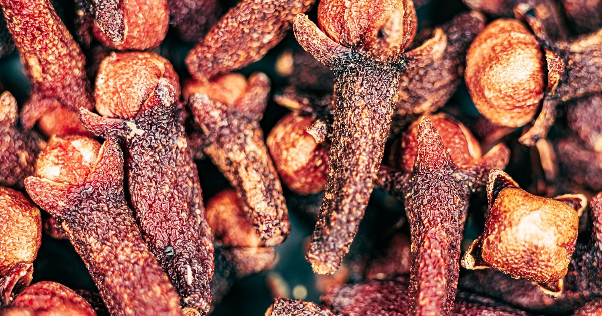 A detailed close-up of dried clove spices showcasing texture and color.