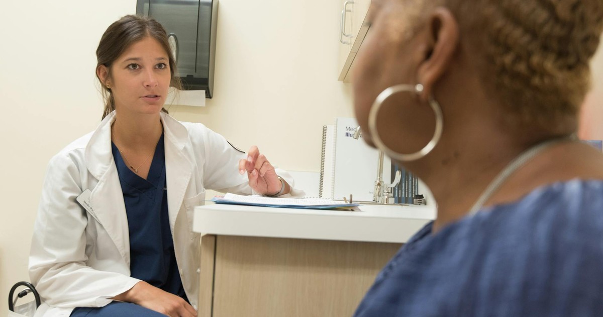 Doctor in consultation with patient at a medical clinic, discussing treatment options.