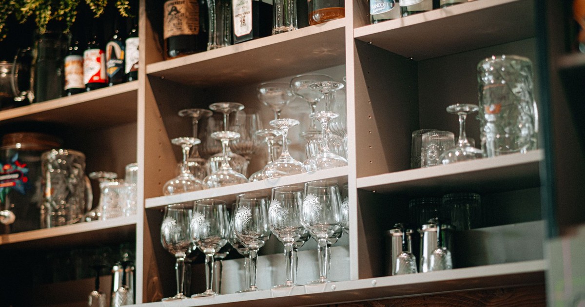 Elegantly arranged glassware in a bar setting, emphasizing cleanliness and organization.