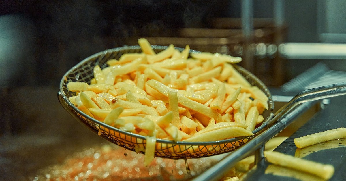 Crispy golden french fries fresh from the deep fryer, ready to eat and indulge.