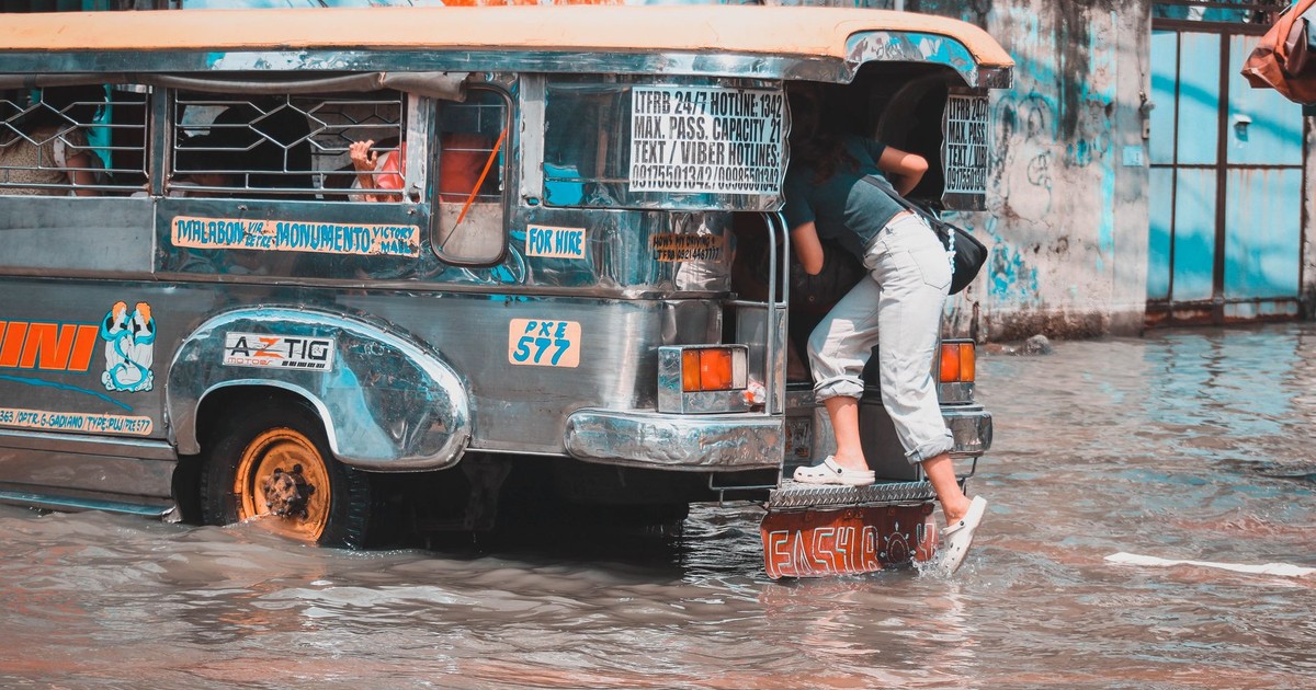 Jeepney navigating through a flooded street in Malabon, Metro Manila.