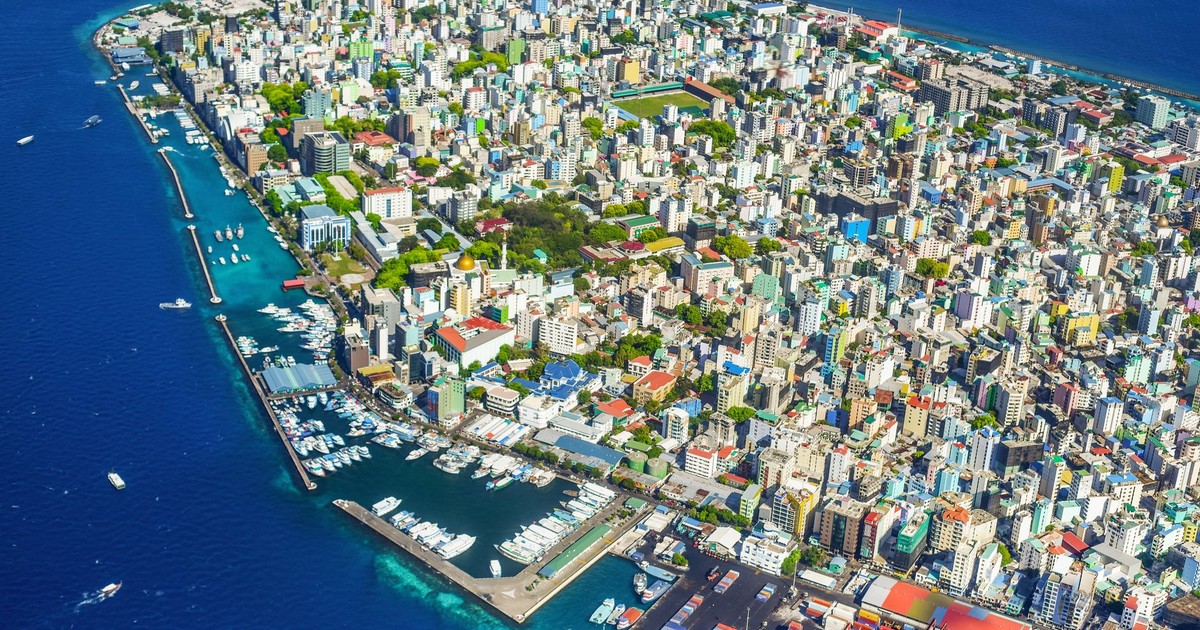 Stunning aerial shot of Malé, Maldives, showcasing colorful buildings and a vibrant coastline.