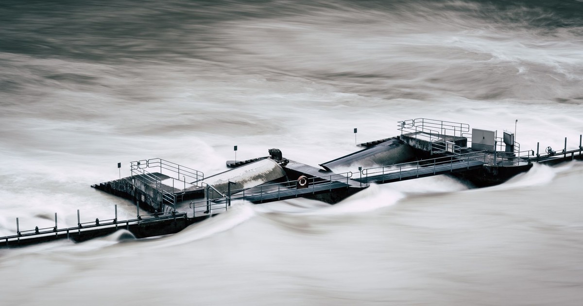 An aerial view of a structure overwhelmed by a river flood in Bern, Switzerland.