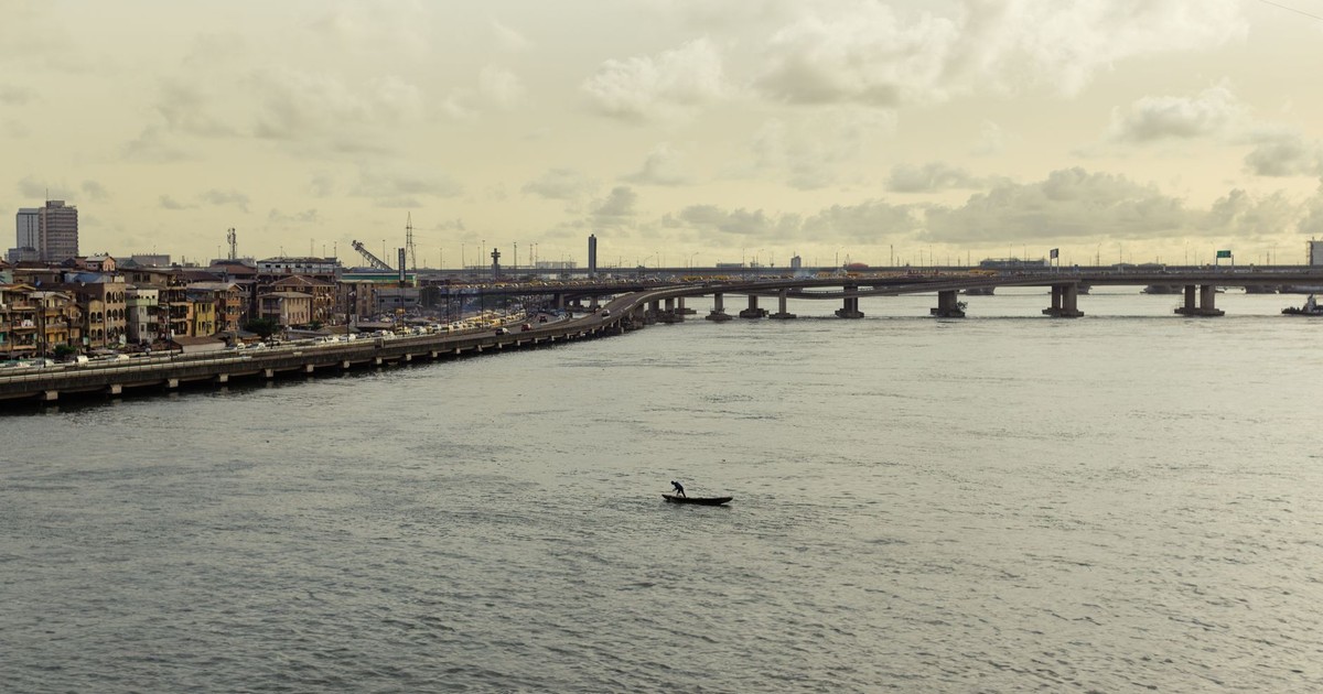 A tranquil scene of Carter Bridge spanning over water in Lagos, capturing urban and waterside charm.