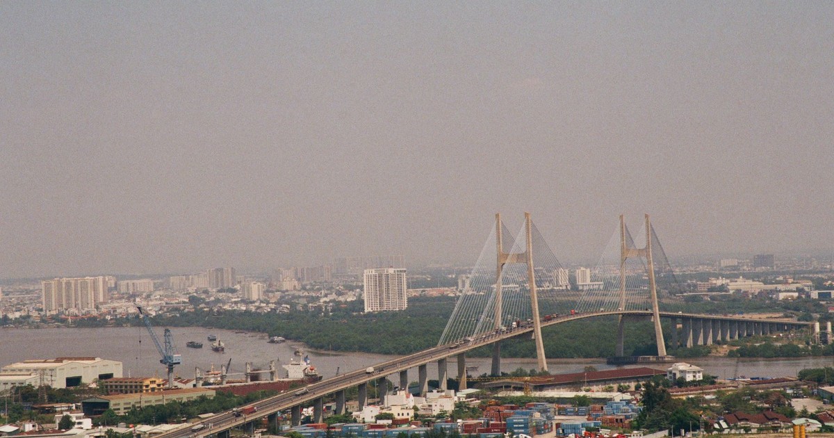 Aerial view showcasing the Thu Thiem Bridge and urban skyline in Ho Chi Minh City, Vietnam.