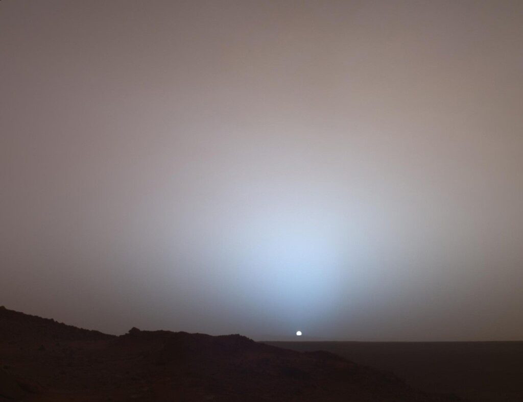 NASA's Mars Exploration Rover Spirit captured a sweeping view as the sun sank below the rim of Gusev Crater on Mars Image Credit: NASA