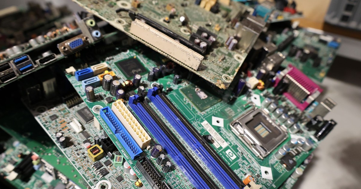 Close-up of stacked circuit boards illustrating e-waste recycling and technology management.