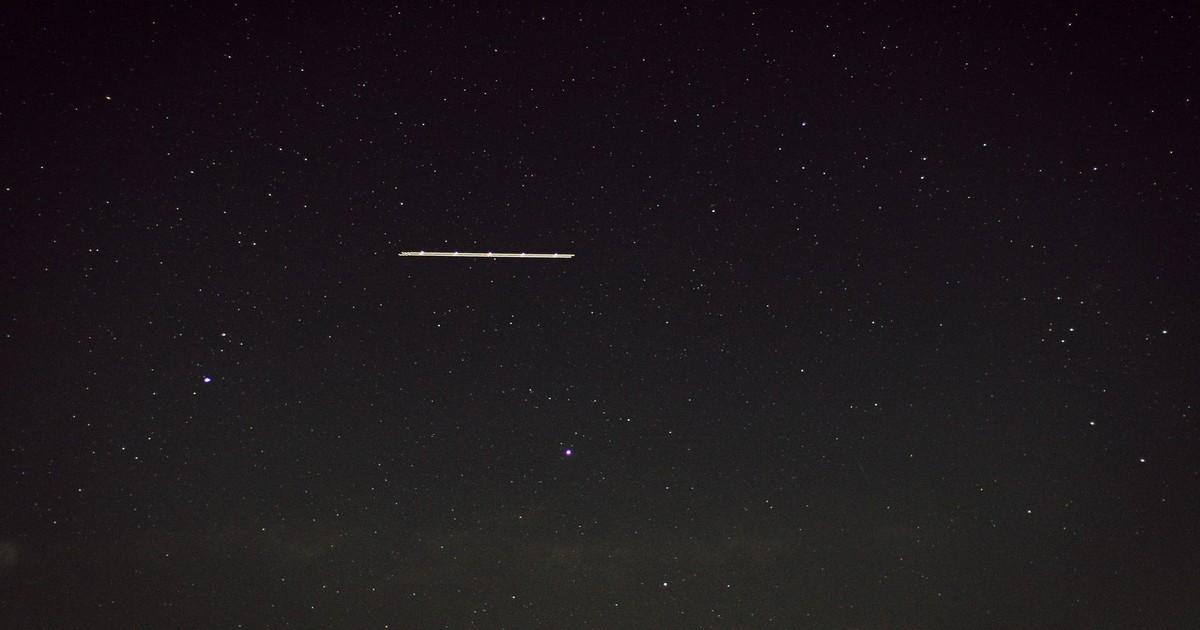 Captivating star-filled night sky with a mysterious line of light, captured in Germany.