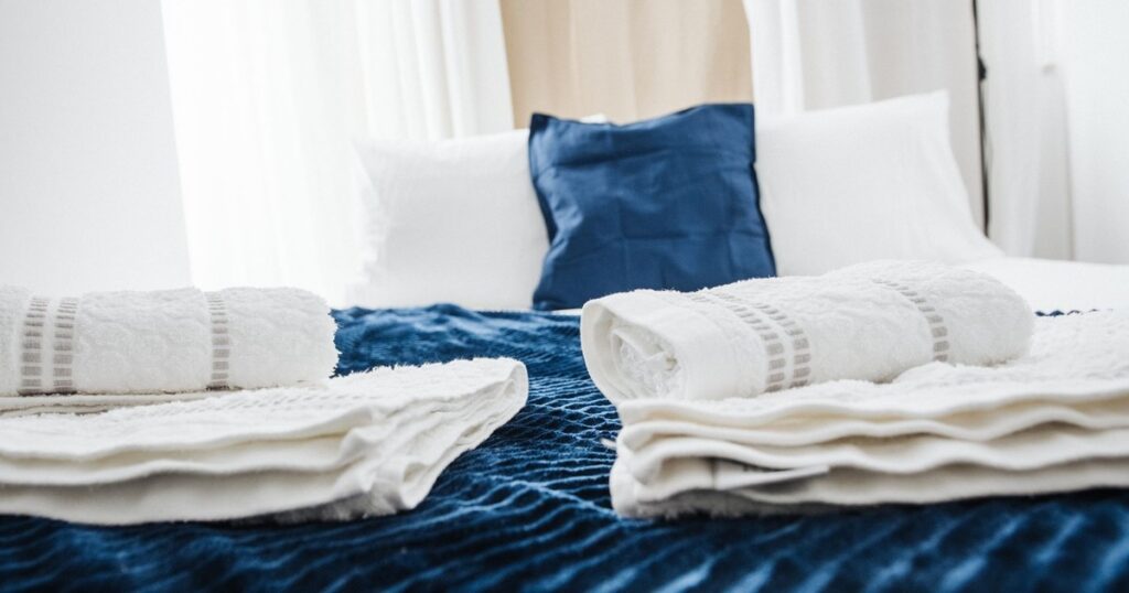 Why You Should Always Wash Guest Room Sheets Before Guests Arrive - Featured image