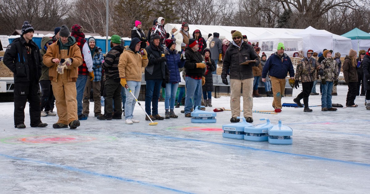 Group enjoying a winter curling event outdoors in Wabasha, Minnesota.