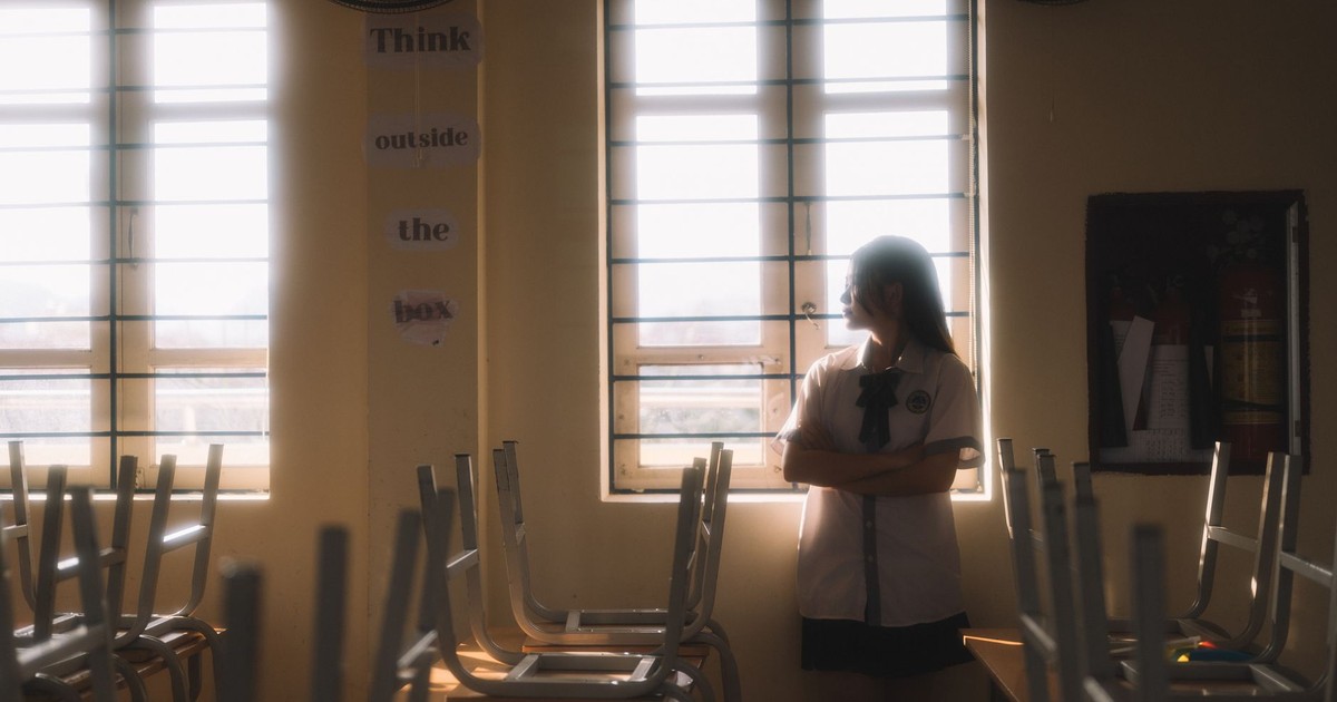 A thoughtful student looks out the window in a sunlit classroom in Lạng Sơn, Vietnam.