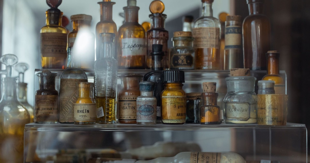 Collection of vintage apothecary bottles showcasing historical pharmaceutical storage.
