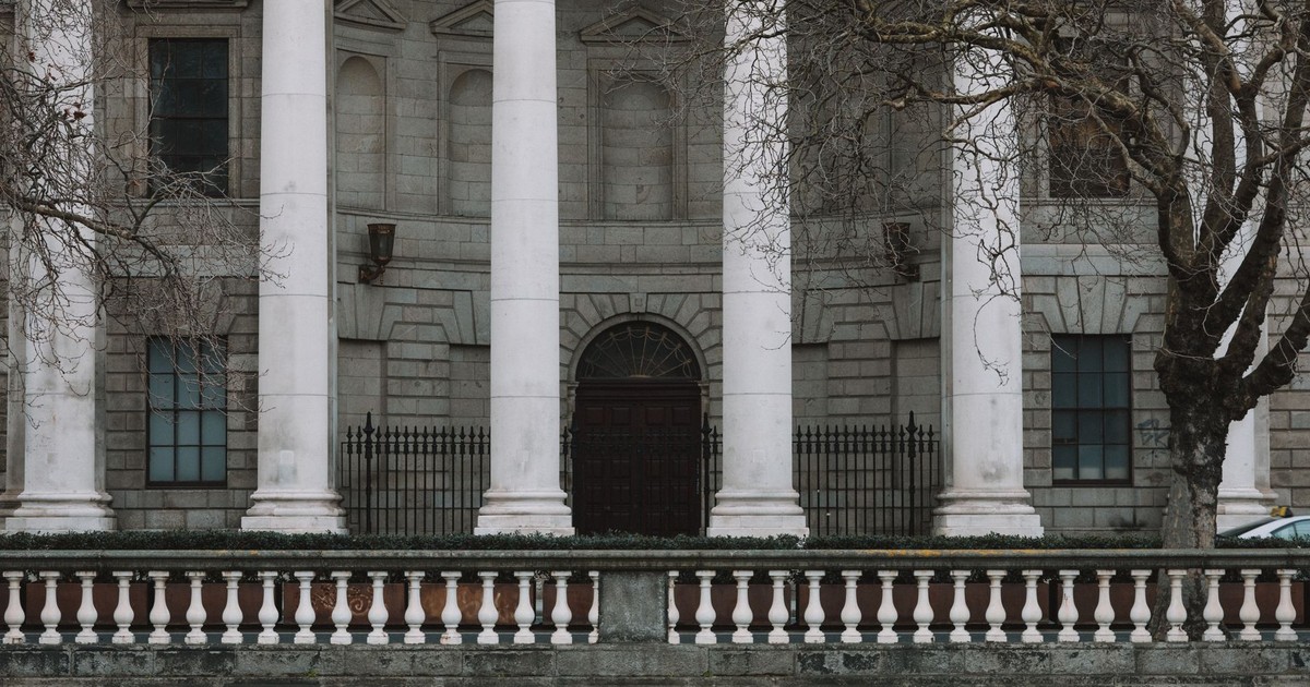 Elegant neoclassical facade of Dublin's Four Courts with iconic white columns.