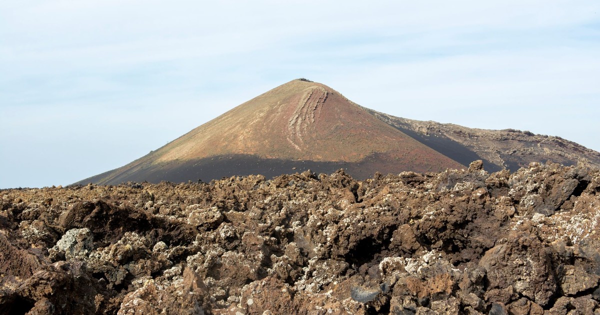 Scenic view of volcanic landscape with rocky terrain in Lanzarote, Spain.